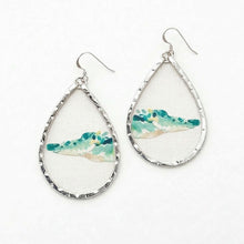 Teardrop-shaped earrings with watercolor design on a white background alligator