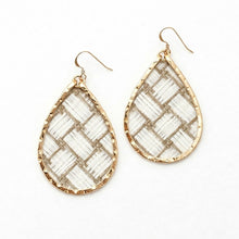 Teardrop-shaped earrings with woven pattern and gold frame on a white background