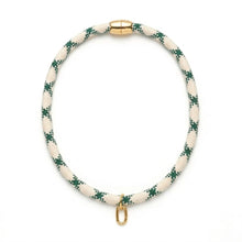 Necklace with green and white pattern on a white background