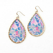 Teardrop-shaped earrings with colorful pattern and gold frame on a white background
