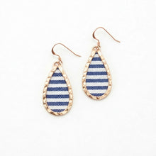 Teardrop-shaped earrings with blue and white striped pattern on a white background