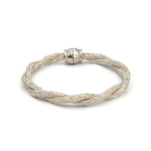 Silver braided bracelet with a silver clasp on a white background